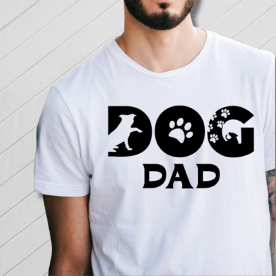 Man wearing a white t-shirt with 'DOG DAD' text and dog paw prints.