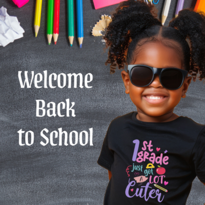 Child wearing a '1st Grade Just Got a Lot Cuter' shirt with colorful pencils and erasers on a chalkboard background.