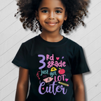 Child wearing a black t-shirt with colorful text on a white background