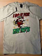 A cream-colored t-shirt with a graphic print of Santa Claus and the text 'I Do It for the Ho's'