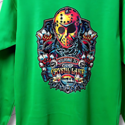 A long sleeve green t-shirt with a graphic print of a horror movie character and the text 'Crystal Lake'.