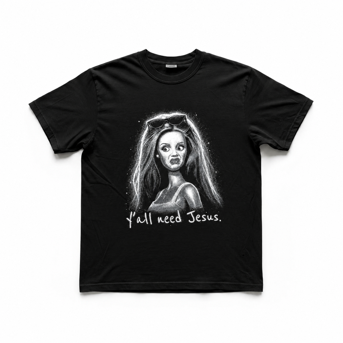 A black short-sleeve crewneck t-shirt featuring a grayscale graphic of a woman with the text 'Y'all need Jesus.' printed below, displayed flat against a white background.