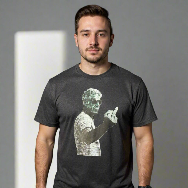 Man wearing a black t-shirt with a graphic design on a black background