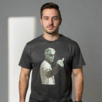 Man wearing a black t-shirt with a graphic design on a black background