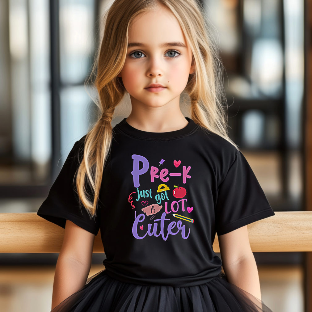 Young girl wearing a black t-shirt with colorful text and graphics.
