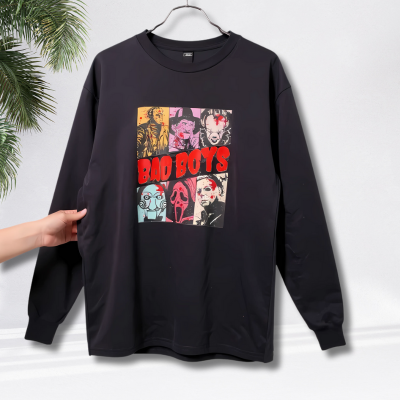 Black long-sleeve shirt with graphic design on a hanger against a white background