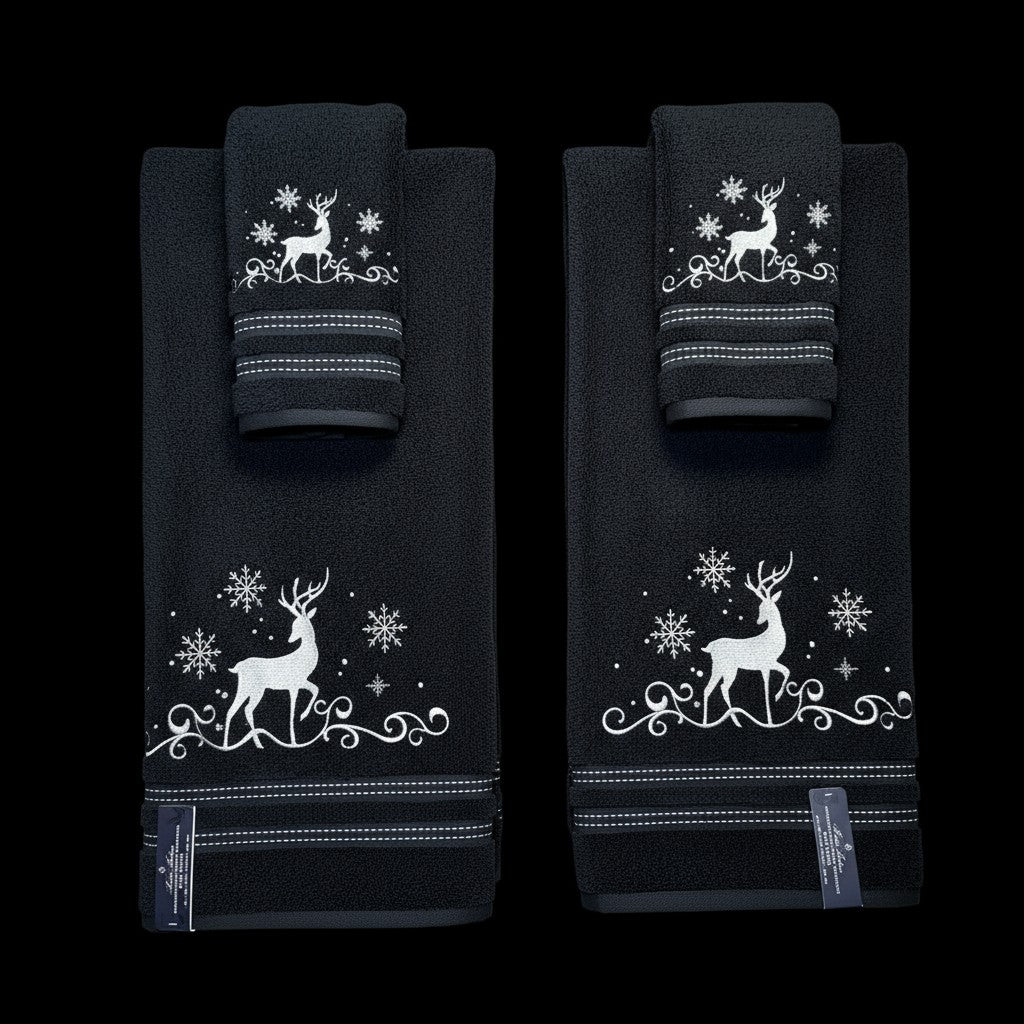 Set of black towels with white deer and snowflake designs on a black background