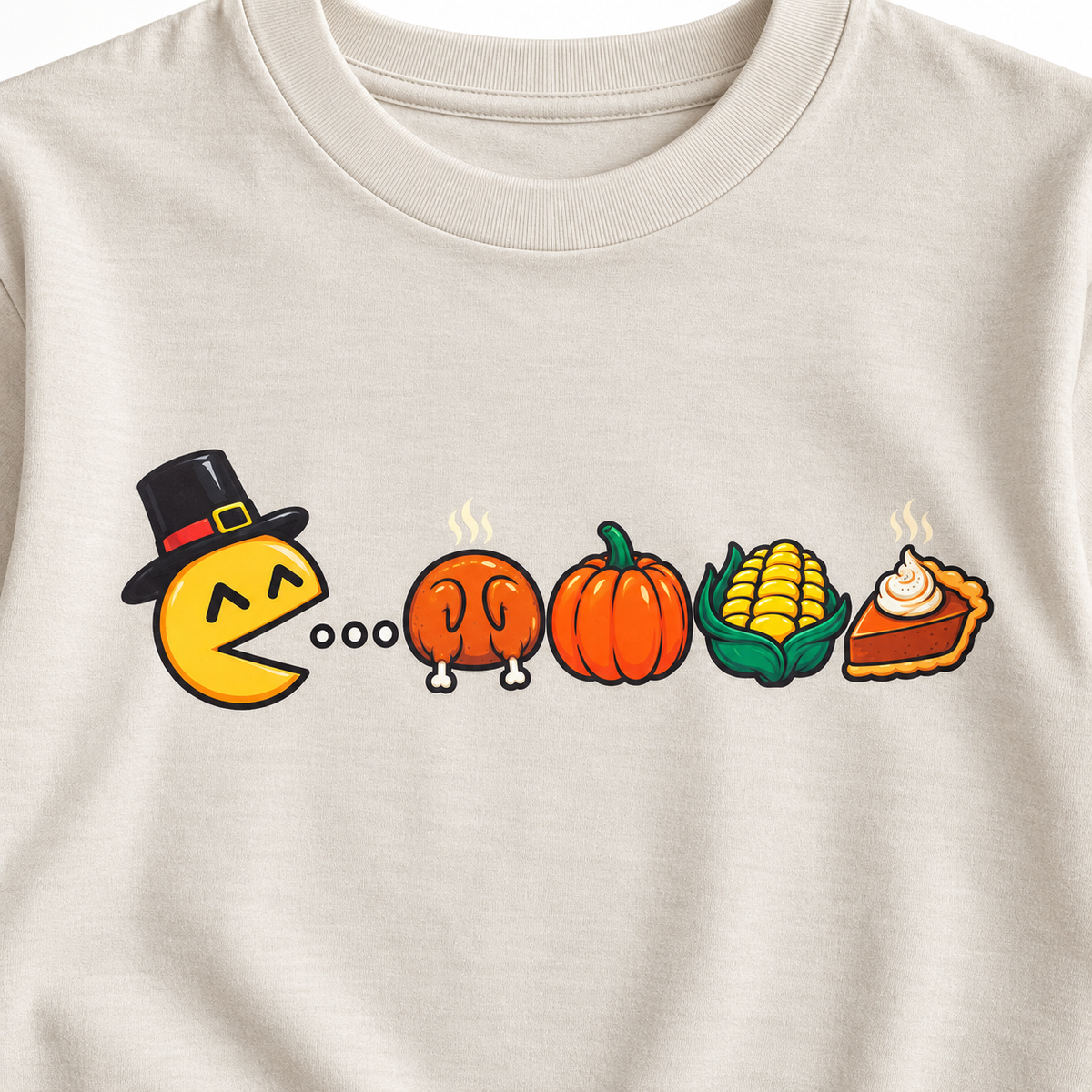 Close-up of the retro-inspired Thanksgiving graphic featuring a pilgrim character, turkey, pumpkin, corn, and pie.