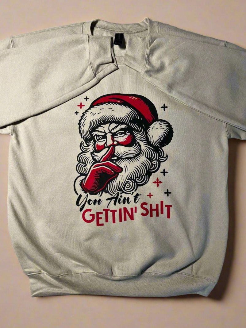 Retro Santa cream sweatshirt with bold phrase “You Ain’t Gettin’ Sh*t” – funny Christmas holiday sweater