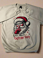 Retro Santa cream sweatshirt with bold phrase “You Ain’t Gettin’ Sh*t” – funny Christmas holiday sweater