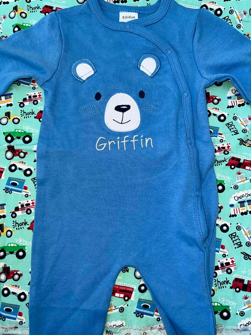 Baby sleeper with a bear face and ears applique that is customized with the name Griffin. 