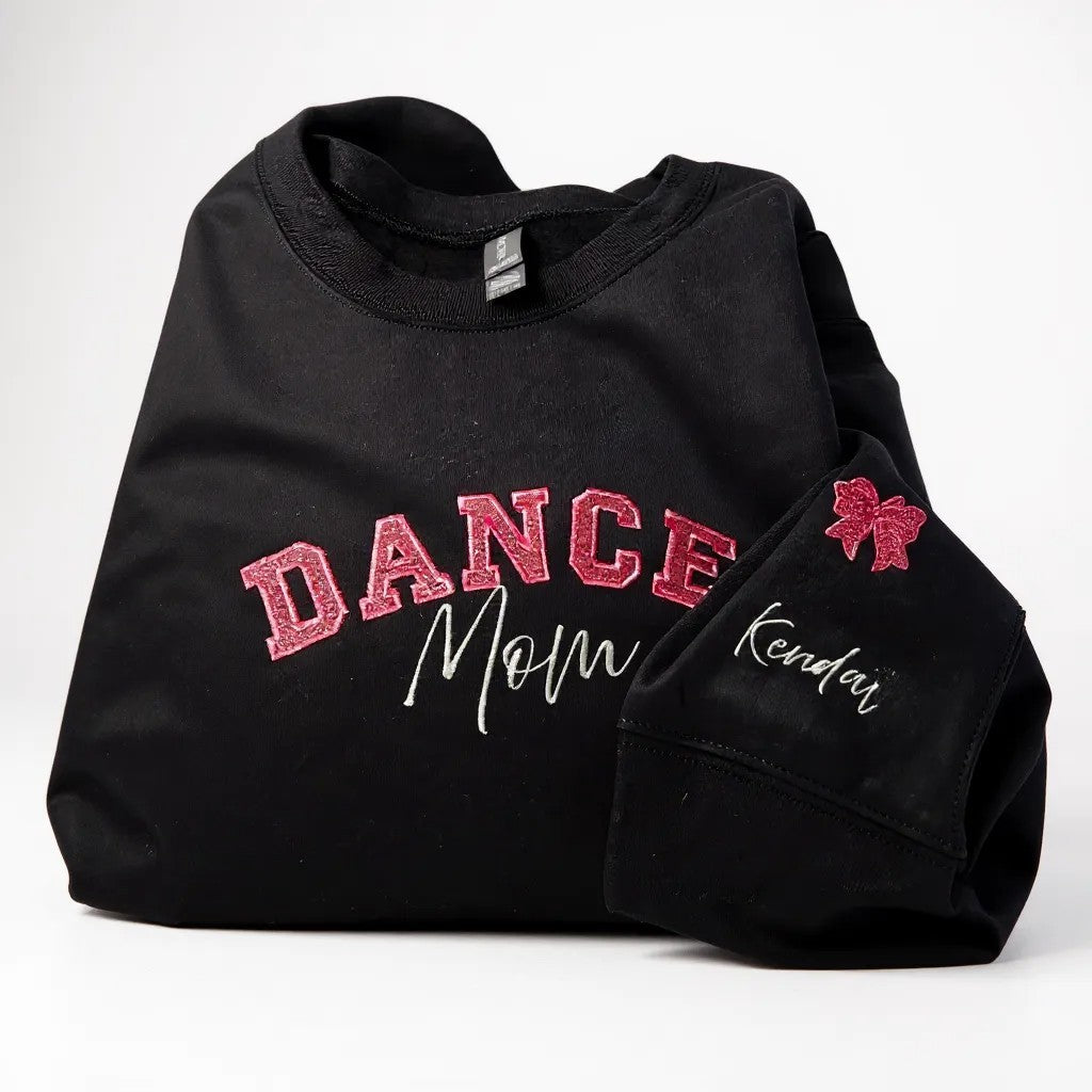 Black sweatshirt with 'DANCE Mom' text and a red bow on a white background