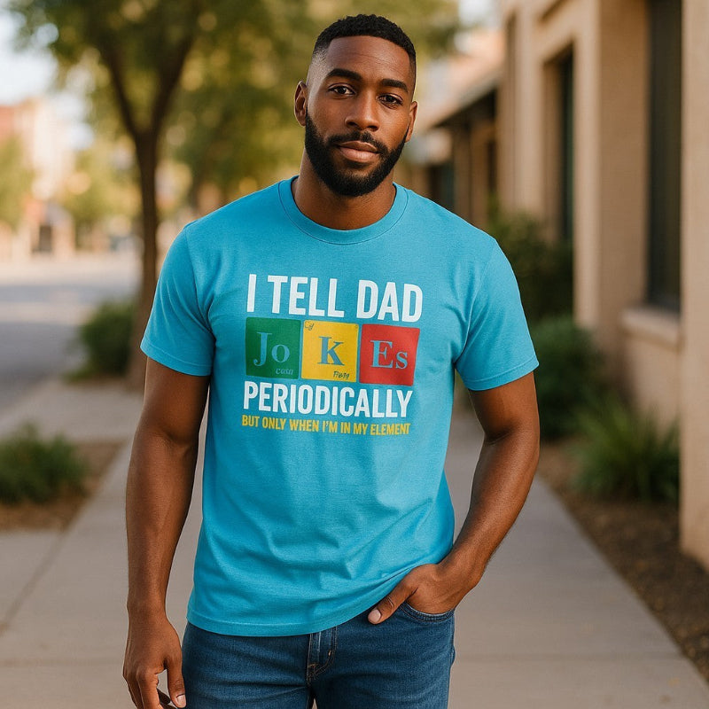 Man wearing funny dad jokes t-shirt with periodic table design on sidewalk.