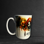 White mug with horror-themed design featuring characters and the text 'Horror Fuel' on a blue background.