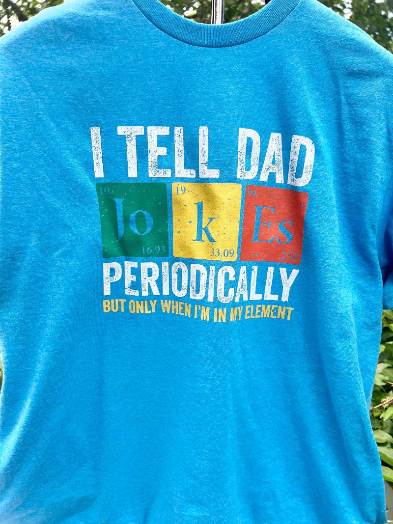Close up of light blue shirt with periodical table with a dad joke pun.