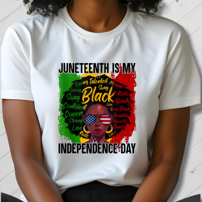 Person wearing a white t-shirt with Juneteenth design
