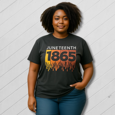Person wearing a black t-shirt with 'Juneteenth 1865' design outdoors.