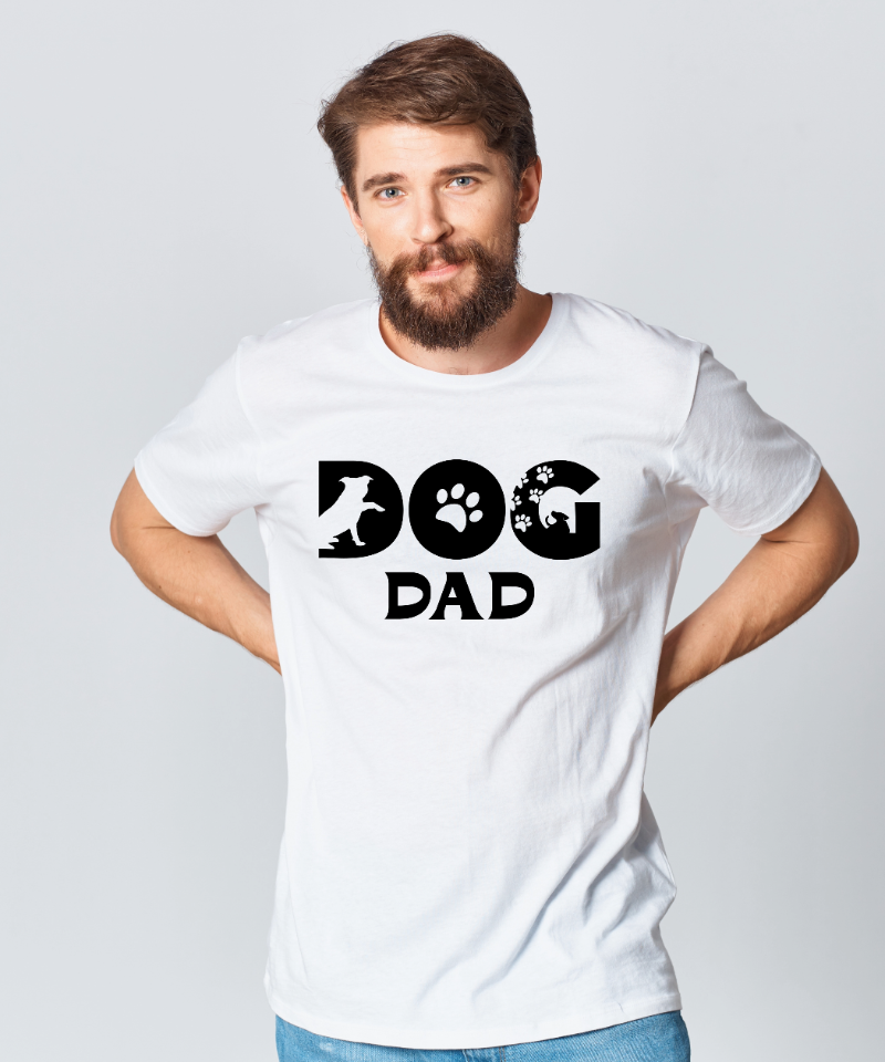 Man wearing a white t-shirt with 'DOG DAD' text and paw prints on a plain background