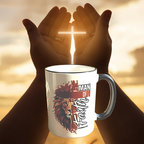 Mug with lion design and text on a wooden surface with the bible.