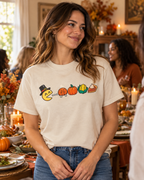 Woman styling the cream Nostalgic Thanksgiving Graphic Tee with jeans at a Friendsgiving dinner.