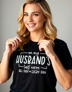 Model wearing a funny graphic tee – black cotton short sleeve shirt with bold white text that says "On My Husbands Last Nerve"
