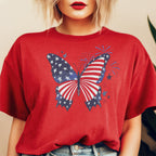 Woman in red American flag butterfly shirt for patriotic celebrations.