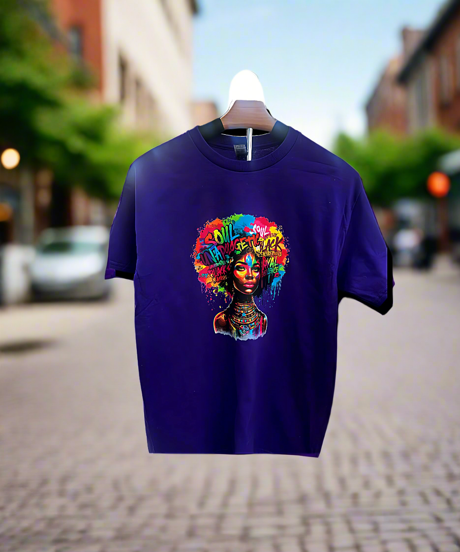 Purple t-shirt with colorful graphic design of a woman's face on a hanger in an urban setting.