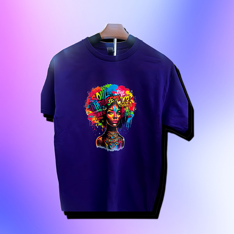 Purple t-shirt with colorful graphic design on a hanger against a gradient background