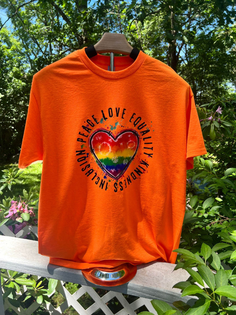 Orange Pride Day t-shirt with rainbow heart and words love, peace, equality, kindness, inclusion