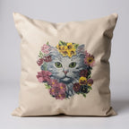 Beige pillow with a cat and floral design on a light gray background