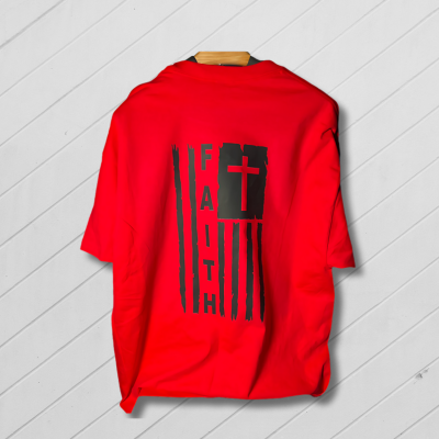 Red sweatshirt with black text on a light wooden floor