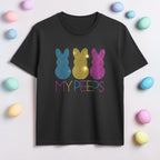 Black t-shirt with colorful 'MY PEEPS' design on a light background with Easter eggs.