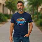 Man wearing Super Dad graphic tee in navy outdoors.