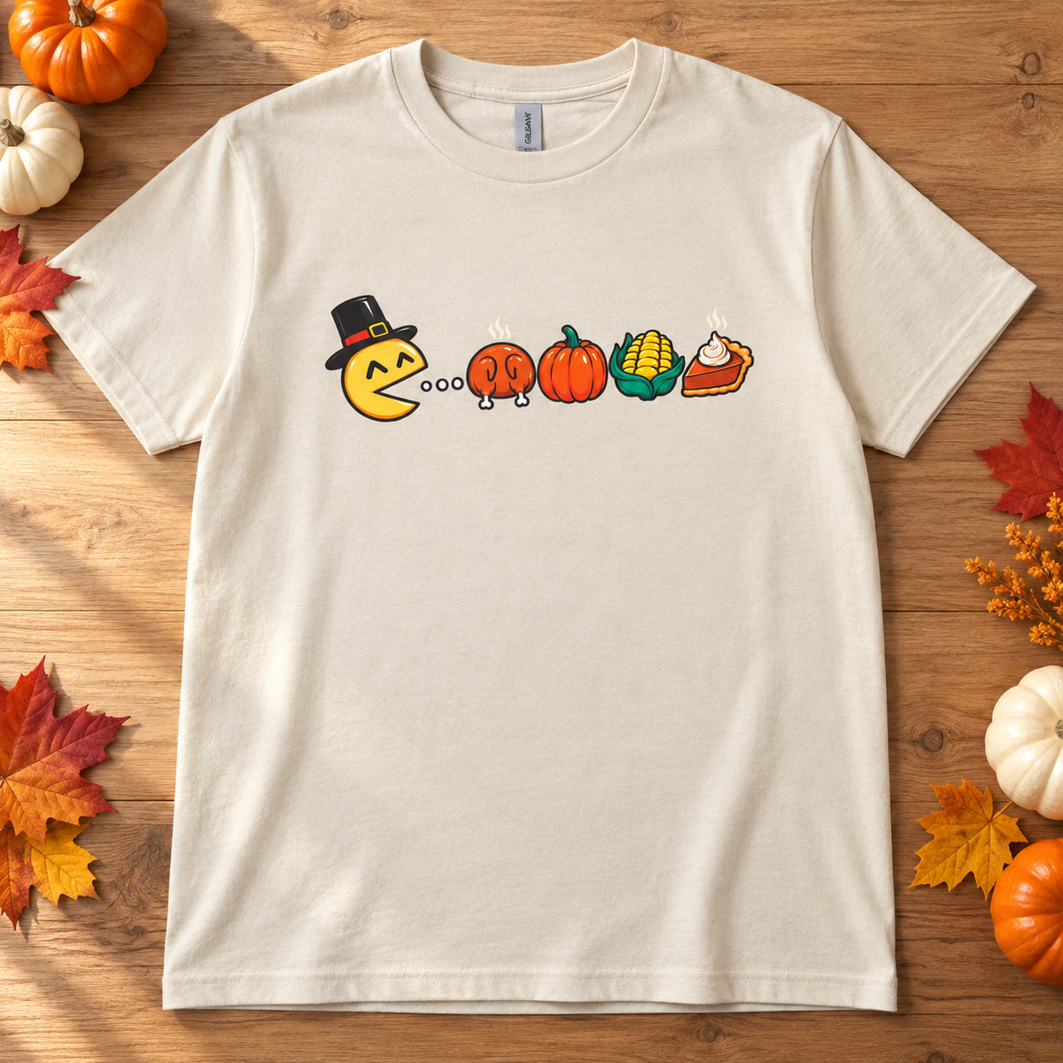 Nostalgic Thanksgiving Graphic Tee on a wood surface with pumpkins and autumn leaves