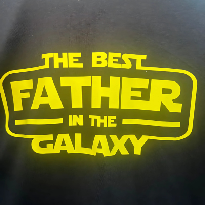 Close up of the graphic The Best Father in the Galaxy t-shirt.