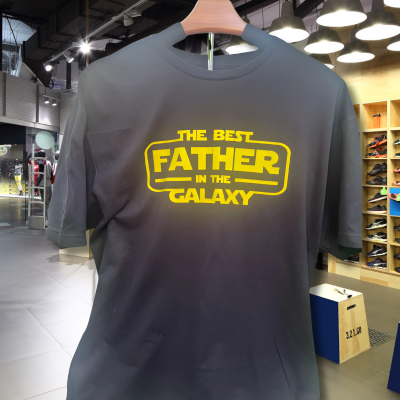 The Best Father in the Galaxy graphic tee with green background