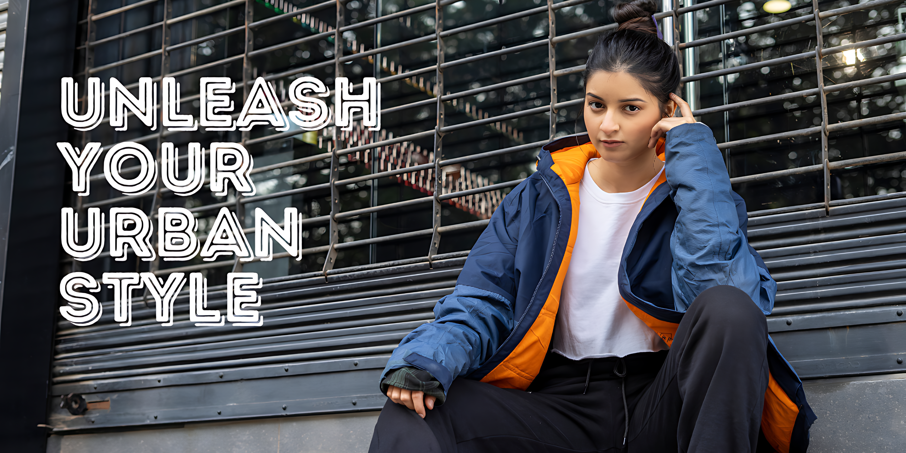 Person wearing a blue and orange jacket with text 'Unleash Your Urban Style' in an urban setting.