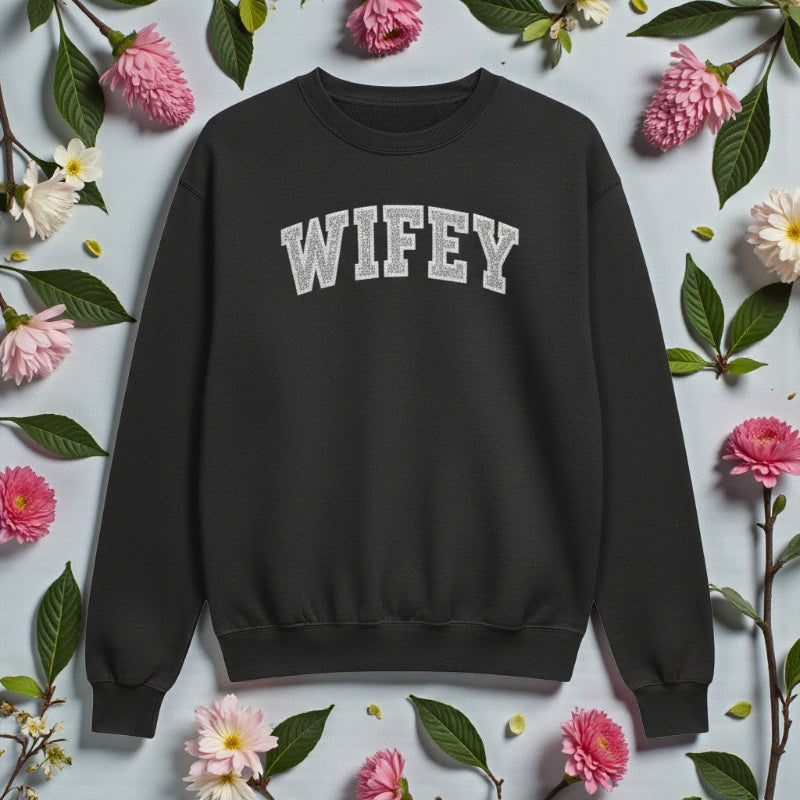 Black sweatshirt with 'WIFEY' text on a floral background
