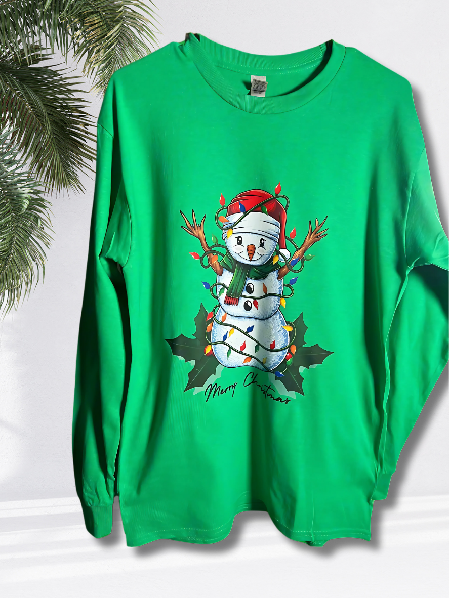 A green long-sleeve T-shirt with a graphic print of a snowman wrapped in Christmas lights and mistletoe.