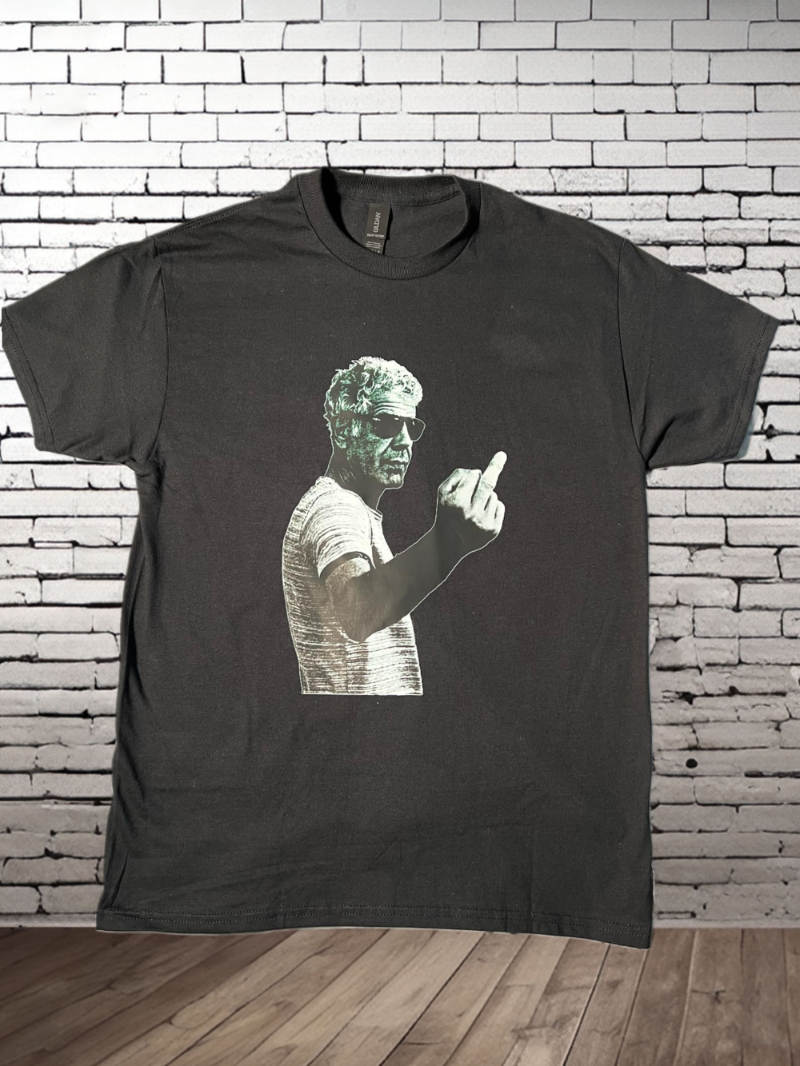 A black t-shirt featuring a graphic print of a person giving a middle finger gesture.
