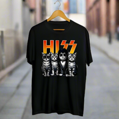 Black t-shirt with cat graphic and 'HISS' text on a hanger against a blurred street background