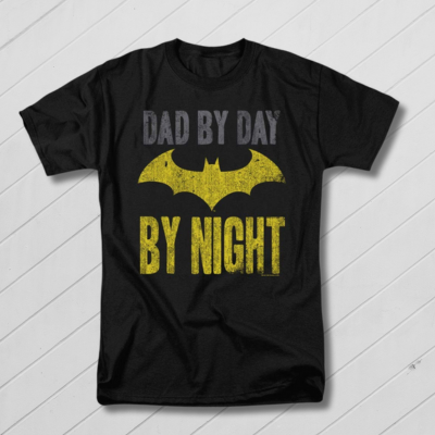Black t-shirt with yellow bat symbol and text 'Dad by day, By night' on a blue background
