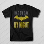 Black t-shirt with yellow bat symbol and text 'Dad by day, By night' on a white background