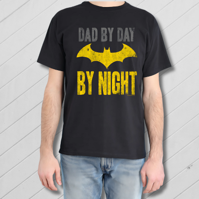 Black t-shirt with yellow bat symbol and text 'Dad by day, By night' on a blue background