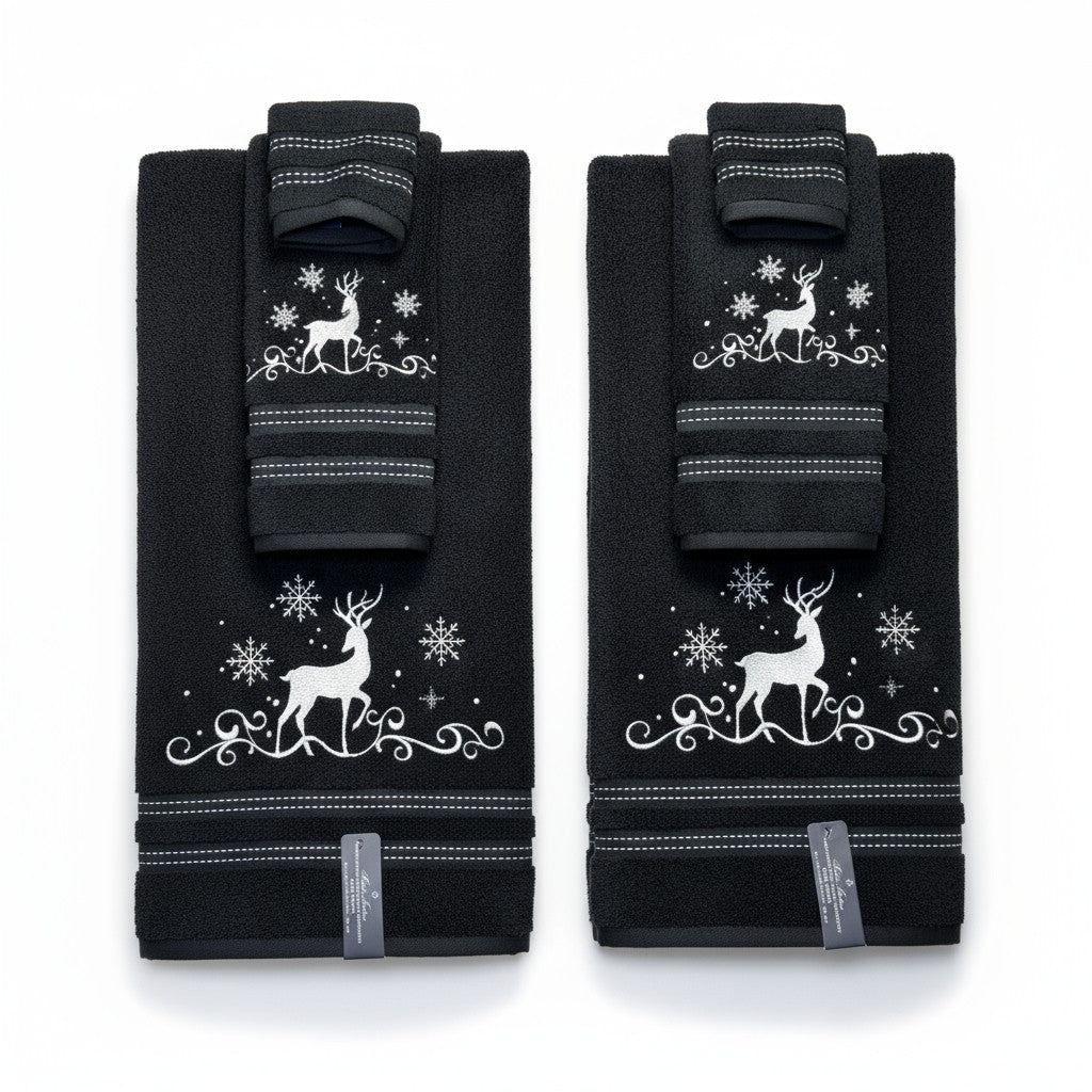 Pair of black knee pads with white reindeer and snowflake design on a white background