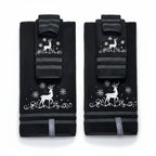 Pair of black knee pads with white reindeer and snowflake design on a white background