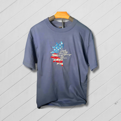 Blue t-shirt with American flag design on a wooden background