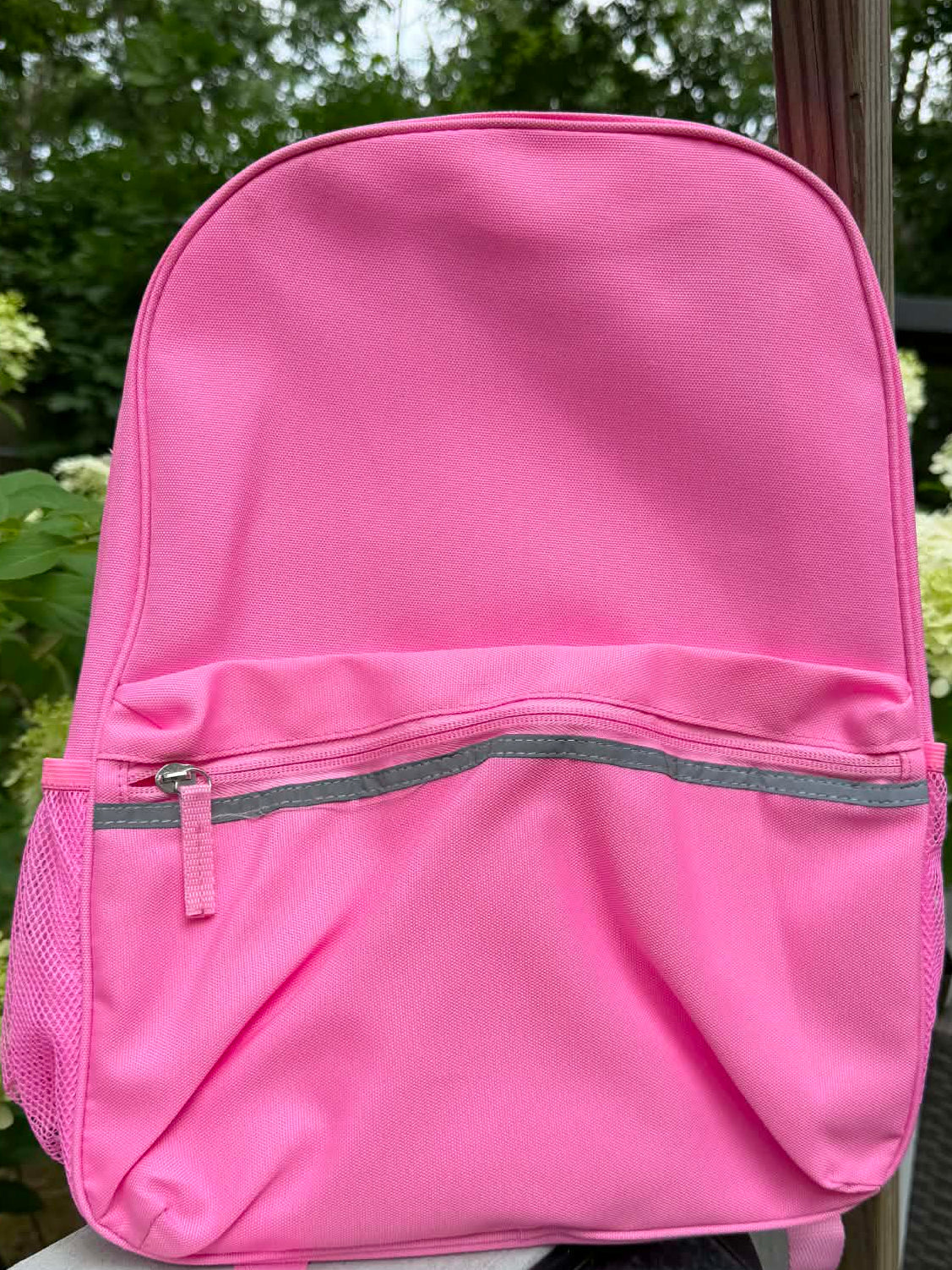 Pink backpack customized with embroidered name