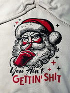close up of a sarcastic Christmas sweatshirt featuring vintage Santa illustration and humorous text