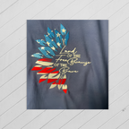 Navy blue shirt with colorful leaf design and text on a light gray background